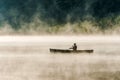 Canada Ontario Lake of two rivers Canoe Canoes foggy water sunrise fog golden hour on water in Algonquin National Park Royalty Free Stock Photo