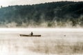 Canada Ontario Lake of two rivers Canoe Canoes foggy water sunrise fog golden hour on water in Algonquin National Park Royalty Free Stock Photo