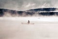 Canada Ontario Lake of two rivers Canoe Canoes foggy water sunrise fog golden hour on water in Algonquin National Park Royalty Free Stock Photo