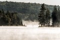 Canada Ontario Lake of two rivers Canoe Canoes foggy water sunrise fog golden hour on water in Algonquin National Park Royalty Free Stock Photo