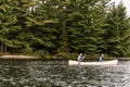 Canada Ontario Lake of two rivers Couple on a Canoe Canoes on the water Algonquin National Park Royalty Free Stock Photo