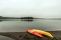 Canada Ontario Lake two rivers grey morning dark atmosphere Canoe Canoes parked beach water in Algonquin National Park