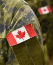 Canada patch flag on soldiers arm Royalty Free Stock Photo