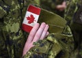 Canada patch flag on soldiers arm Royalty Free Stock Photo