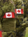 Canada patch flags on soldiers arm. Canadian troops Royalty Free Stock Photo