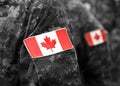 Canada patch flags on soldiers arm. Canadian troops Royalty Free Stock Photo