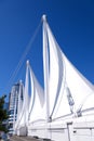 Canada Place and commercial buildings in downtown Vancouver port and pier liner ships arrive people strolling view