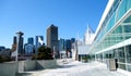 Canada Place and commercial buildings in downtown Vancouver port and pier liner ships arrive people strolling view