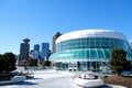 Canada Place and commercial buildings in downtown Vancouver port and pier liner ships arrive people strolling view