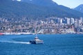 Canada Place and commercial buildings in downtown Vancouver port and pier liner ships arrive people strolling view