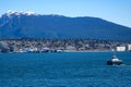 Canada Place and commercial buildings in downtown Vancouver port and pier liner ships arrive people strolling view