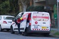 A Canada Post employee sorts packages inside the Canada Post Van in Downtown Vancouve