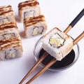 canada rolls on sticks over a saucepan with soy sauce Royalty Free Stock Photo