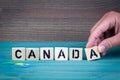 Canada. Wooden letters on the office desk, informative and communication background