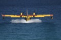 Canadair plane carrying water in a training maneuver to fight forest fires Royalty Free Stock Photo