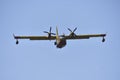 Canadair plane carrying water in a training maneuver to fight forest fires Royalty Free Stock Photo