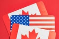 Canadian and american flags on red background: symbolizing north american unity Royalty Free Stock Photo