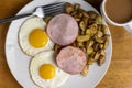 canadian bacon with fried eggs and home fries