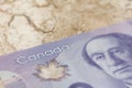 Canadian currency. Dollars. Closeup on marble table.