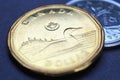 1 Canadian dollar. Fragment of textured coin. Illustration about economy or finance. Coins and money change of Canada. News about