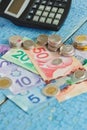 Canadian dollars, coins and calculator on the wooden background Royalty Free Stock Photo