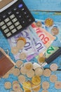 Canadian dollars, coins, loupe and notebook on the wooden background Royalty Free Stock Photo