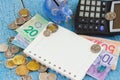 Canadian dollars, coins, piggy bank and notebook on the wooden background Royalty Free Stock Photo