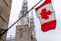 Canadian flags in front of the Notre-Dame Cathedral Basilica in Ottawa, Canada Royalty Free Stock Photo