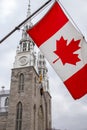 Canadian flag in front of the Notre-Dame Cathedral Basilica in Ottawa, Canada Royalty Free Stock Photo
