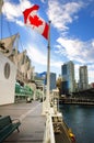 Canadian flag in front of Vancouver, Canada Royalty Free Stock Photo