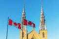 Canadian flags in front of the Notre-Dame Cathedral Basilica in Ottawa, Canada Royalty Free Stock Photo