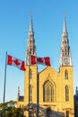 Canadian flags in front of the Notre-Dame Cathedral Basilica in Ottawa, Canada Royalty Free Stock Photo