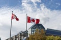 Canadian flags in the wind in front of blue sky Royalty Free Stock Photo