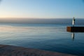 Canadian Geese swimming at the pier during sunrise Royalty Free Stock Photo