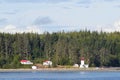 Canadian lighthouse and buildings on Inside Passage cruise.