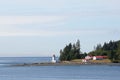 Canadian lighthouse and buildings on Inside Passage cruise.