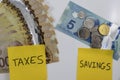 Canadian Money with a note saying savings and taxes Royalty Free Stock Photo