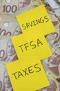 Canadian Money with a note saying taxes, tfsa and savings on it Royalty Free Stock Photo