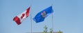 Canadian National and Alberta Provincial Flags at full mast