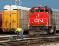 Canadian National switch man reroutes a locomotive Royalty Free Stock Photo