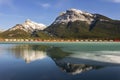 Canadian Pacific Freight Train Railway Alberta Foothills Rocky Mountains Frozen Lake Reflection Landscape Royalty Free Stock Photo