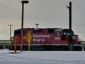 Canadian Pacific Locomotive In Snow Swept Rail Yard