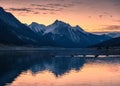 Canadian Rockies with colorful sky and flock of teal floating on Medicine Lake in Jasper national park Royalty Free Stock Photo