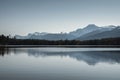 Canadian Rockies with pine forest and clear sky reflection at Pyramid lake, Jasper national park Royalty Free Stock Photo