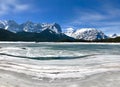 The canadian rocky mountains in winter with a frozen lake