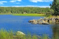 Canadian Shield Rock Outcroppings with Cameron River flowing through Reeds and Rocks, Hidden Lake Territorial Park, Canada Royalty Free Stock Photo