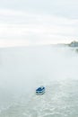 Canadian side of Niagara Falls in autumn. ship with tourists Royalty Free Stock Photo