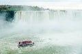 Canadian side of Niagara Falls in autumn. ship with tourists Royalty Free Stock Photo