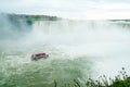 Canadian side of Niagara Falls in autumn. ship with tourists Royalty Free Stock Photo