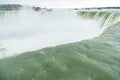 Canadian side of Niagara Falls in autumn. ship with tourists Royalty Free Stock Photo